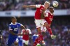 Arsenal's Oleksandr Zinchenko, second right, and Gabriel head the ball away from Leicester City's Youri Tielemans, left, during their English Premier League soccer match at the Emirates Stadium, London, Saturday, Aug. 13, 2022. (Mike Egerton/PA via AP)