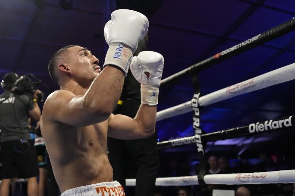 Teofimo Lopez celebrates after defeating Pedro Campa by TKO in a junior welterweight boxing match, Saturday, Aug. 13, 2022, in Las Vegas. (AP Photo/John Locher)