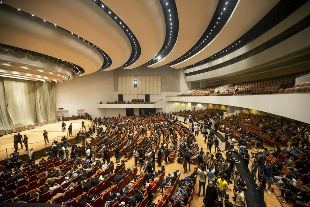 FILE - Followers of Shiite cleric Muqtada al-Sadr fill the parliament building during a sit-in protest, in Baghdad, Iraq, Thursday, Aug. 4, 2022. Iraq’s top judicial body said Sunday, Aug. 14, 2022, that it doesn't have the authority to dissolve the country’s parliament, days after al-Sadr gave it one week to dismiss the legislature so new elections can be held. The decision by the Supreme Judicial Council is likely to increase tensions between followers of cleric Muqtada al-Sadr and members of Iran-backed groups as Iraq sinks deeper into its political impasse, now in its 10th month. (AP Photo/Anmar Khalil, File)