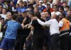Chelsea's head coach Thomas Tuchel argues with Tottenham's head coach Antonio Conte during the English Premier League soccer match between Chelsea and Tottenham Hotspur at Stamford Bridge Stadium in London, Sunday, Aug. 14, 2022. (AP Photo/Ian Walton)