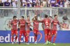 Cremonese's David Okereke, center, celebrates with teammates after scoring his team's first goal during the Italian Serie A soccer match between Fiorentina vs Cremonese at the Artemio Franchi Stadium in Florence, Italy, Sunday, Aug. 14, 2022. (Massimo Paolone/LaPresse via AP)