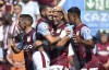Aston Villa's Emiliano Buendia, centre left, celebrates with teammate Diego Carlos after scoring his side's second goal during the English Premier League soccer match between Aston Villa and Everton at Villa Park in Birmingham, England, Saturday, Aug. 13, 2022. (AP Photo/Rui Vieira)