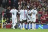 Crystal Palace's Wilfried Zaha, centre, celebrates with teammates after scoring his side's opening goal during the English Premier League soccer match between Liverpool and Crystal Palace at Anfield stadium in Liverpool, England, Monday, Aug. 15, 2022. (AP Photo/Jon Super)