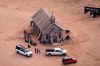 FILE - This aerial photo shows part of the Bonanza Creek Ranch film-set in Santa Fe, N.M., on Oct. 23, 2021. New Mexico's Office of the Medical Investigator has determined that the fatal film-set shooting of a cinematographer by actor and producer Alec Baldwin last year was an accident. (AP Photo/Jae C. Hong, File)