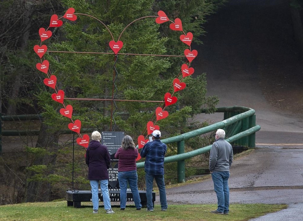 A former Supreme Court of Canada justice working with the inquiry into the 2020 Nova Scotia mass shooting that left 22 dead says he was concerned to hear a top Mountie say he was advised not to proactively share information relevant to the inquiry. Visitors pay their repects at a memorial honouring the victims of the April 2020 murder rampage in rural Nova Scotia, in Victoria Park in Truro, N.S. on Tuesday, April 13, 2021. THE CANADIAN PRESS/Andrew Vaughan