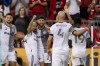Toronto FC midfielder Jonathan Osorio (21), centre, celebrates his goal with teammate midfielder Lorenzo Insigne (24) during first half MLS Soccer action against Portland Timbers in Toronto on August 13, 2022. With a swift turnaround has come late-season pressure and urgency to make the playoffs. Toronto FC enters a key game against the New England Revolution Wednesday night, just four points out of a post-season spot in the Eastern Conference. Currently on a four-game unbeaten run since the debuts of Italian transfers Lorenzo Insigne and Federico Bernardeschi, the pressure is hard to ignore with just nine games remaining. THE CANADIAN PRESS/Andrew Lahodynskyj