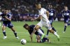 LA Galaxy forward Dejan Joveljic, right, hops over Vancouver Whitecaps midfielder Ryan Gauld during the second half of an MLS soccer match on August 13, 2022, in Carson, Calif. THE CANADIAN PRESS/AP, Raul Romero Jr.