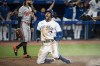 Toronto Blue Jays pitch hitter George Springer (4) celebrates after sliding in to home on a double by Santiago Espinal (5) during seventh inning AL MLB baseball action against the Baltimore Orioles, in Toronto on Wednesday, August 17, 2022. THE CANADIAN PRESS/Christopher Katsarov