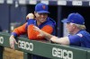 New York Mets manager Buck Showalter, right, talks with pitcher Jacob deGrom before the team's baseball game against the Atlanta Braves Tuesday, Aug. 16, 2022, in Atlanta. (AP Photo/John Bazemore)