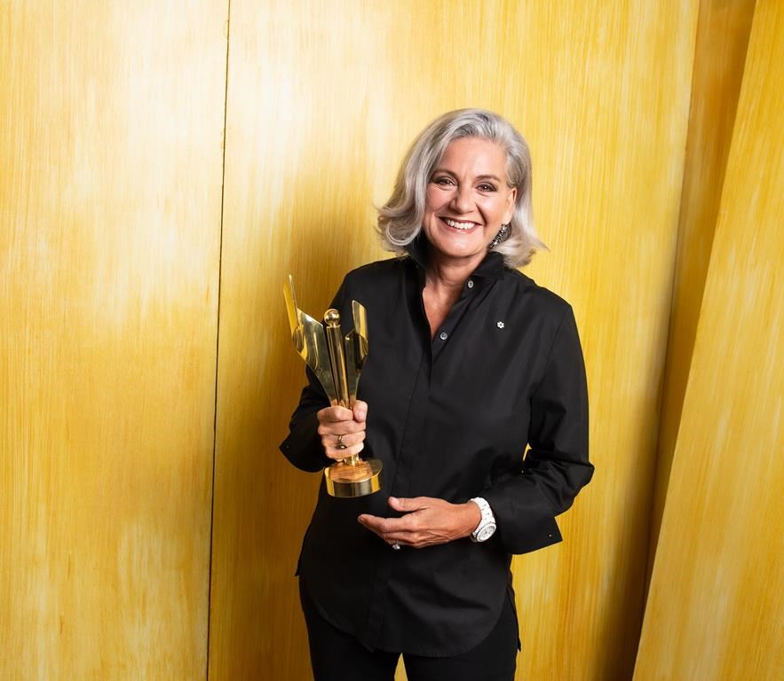 Lisa LaFlamme poses with her Canadian Screen Award for Best News Anchor, National in Toronto Wednesday, Aug. 17, 2022. THE CANADIAN PRESS/HO-George Pimentel *MANDATORY CREDIT*