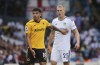 Leeds United's Rasmus Kristensen, right, sporting an injured eye socket, stands next to Wolverhampton Wanderers' Morgan Gibbs-White during the English Premier League soccer match between Leeds United and Wolverhampton Wanderers, at the Elland Road in Leeds, England, Saturday, Aug. 6, 2022. (Ian Hodgson/PA via AP)