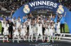 Real Madrid's Karim Benzema lifts the trophy after winning the UEFA Super Cup final soccer match between Real Madrid and Eintracht Frankfurt at Helsinki's Olympic Stadium, Finland, Wednesday, Aug. 10, 2022. Real Madrid won 2-0. (AP Photo/Antonio Calanni)