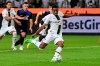 Gladbach's Alassane Plea scores the 1:0 from the penalty spot during the Bundesliga soccer match between Borussia Mönchengladbach and Hertha BSC in Borussia-Park, Mönchengladbach, Germany, Friday Aug. 19, 2022. (Federico Gambarini/dpa via AP)