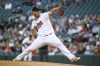 Minnesota Twins pitcher Dylan Bundy throws against the Texas Rangers during the first inning of a baseball game Friday, Aug. 19, 2022, in Minneapolis. (AP Photo/Craig Lassig)
