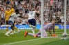 Tottenham's Harry Kane, center, celebrates after scoring the opening goal during the English Premier League soccer match between Tottenham Hotspur and Wolverhampton Wanderers at Tottenham Hotspur in London, Saturday, Aug. 20, 2022. (AP Photo/Frank Augstein)