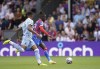 Crystal Palace's Wilfried Zaha, background goes on to score his side's first goal of the game, during the English Premier League soccer match between Crystal Palace and Aston Villa, at Selhurst Park, London, Saturday, Aug. 20, 2022. (Zac Goodwin/PA via AP)