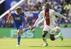 Leicester City's Jamie Vardy, left, and Southampton's Armel Bella-Kotchap battle for the ball during the English Premier League soccer match between Leicester City and Southampton at the King Power Stadium, Leicester, England, Saturday Aug. 20, 2022. (Joe Giddens/PA via AP)