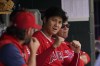 Los Angeles Angels' Shohei Ohtani plays around with a teammate in the dugout in the fifth inning of a baseball game against the Detroit Tigers in Detroit, Saturday, Aug. 20, 2022. (AP Photo/Paul Sancya)