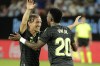Real Madrid's Vinicius Junior, right, celebrates with Real Madrid's Luka Modric after scoring his side's third goal during a Spanish La Liga soccer match between Celta Vigo and Real Madrid at the Balaidos stadium in Vigo, Spain, Saturday, Aug. 20, 2022. (AP Photo/Lalo R. Villar)