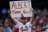 A St. Louis Cardinals' fan celebrates after Albert Pujols hit a solo home run during the fourth inning of a baseball game against the Arizona Diamondbacks, Saturday, Aug. 20, 2022, in Phoenix. (AP Photo/Matt York)