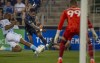 CF Montreal's Romell Quioto drives the ball to the net of New England Revolution goalie Djordje Petrovic during first half MLS soccer action in Montreal on Saturday, August 20, 2022. THE CANADIAN PRESS/Peter McCabe