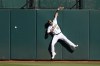 Oakland Athletics right fielder Chad Pinder cannot catch a triple hit by Seattle Mariners' Eugenio Suarez during the fourth inning of a baseball game in Oakland, Calif., Saturday, Aug. 20, 2022. (AP Photo/Jeff Chiu)