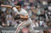 San Francisco Giants starting pitcher Alex Cobb works against the Colorado Rockies in the first inning of a baseball game against the Saturday, Aug. 20, 2022, in Denver. (AP Photo/David Zalubowski)