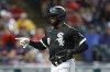 Chicago White Sox's Luis Robert celebrates after scoring on a double by Jose Abreu during the sixth inning of a baseball game against the Cleveland Guardians, Saturday, Aug. 20, 2022, in Cleveland. (AP Photo/Ron Schwane)