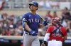 Texas Rangers Nathaniel Lowe reacts after striking out during the first inning of a baseball game against the Minnesota Twins, Sunday, Aug. 21, 2022, in Minneapolis. (AP Photo/Stacy Bengs)