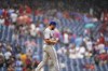 New York Mets pitcher Nate Fisher walks to the mound in a rain storm during the sixth inning of a baseball game against the Philadelphia Phillies, Sunday, Aug. 21, 2022, in Philadelphia. (AP Photo/Matt Slocum)