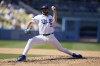 Los Angeles Dodgers relief pitcher Alex Vesia throws to a Miami Marlins batter during the seventh inning of a baseball game Sunday, Aug. 21, 2022, in Los Angeles. (AP Photo/Marcio Jose Sanchez)