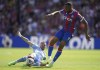 Aston Villa's Emiliano Buendia, left and Crystal Palace's Jordan Ayew battle for the ball, during the English Premier League soccer match between Crystal Palace and Aston Villa, at Selhurst Park, London, Saturday, Aug. 20, 2022. (Zac Goodwin/PA via AP)