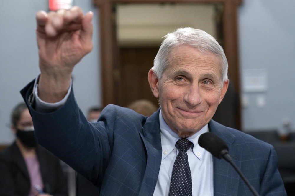 FILE - Dr. Anthony Fauci, Director of the National Institute of Allergy and Infectious Diseases, waves hello to the committee at the start of a House Committee on Appropriations subcommittee on Labor, Health and Human Services, Education, and Related Agencies hearing, about the budget request for the National Institutes of Health, May 11, 2022, on Capitol Hill in Washington. Fauci, the nation's top infectious disease expert who became a household name, and the subject of partisan attacks, during the COVID-19 pandemic, announced Monday he will depart the federal government in December after more than 5 decades of service.  (AP Photo/Jacquelyn Martin, File)