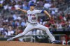 New York Mets starting pitcher Jacob deGrom throws during the third inning of the team's baseball game against the Atlanta Braves, Thursday, Aug. 18, 2022, in Atlanta. (AP Photo/Brett Davis)