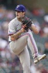 Texas Rangers starting pitcher Cole Ragans delivers against the Minnesota Twins during the third inning of a baseball game Monday, Aug. 22, 2022, in Minneapolis. (AP Photo/Abbie Parr)