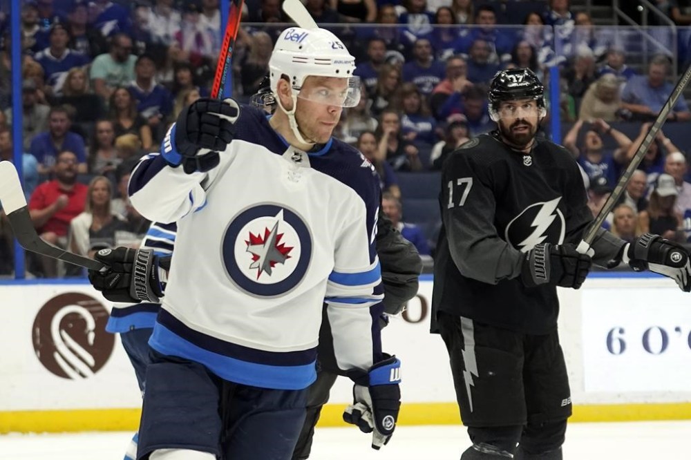FILE - Winnipeg Jets center Paul Stastny, left, celebrates his goal against the Tampa Bay Lightning during the first period of an NHL hockey game Saturday, April 16, 2022, in Tampa, Fla. The Carolina Hurricanes have signed veteran forward Paul Stastny to a $1.5 million contract for next season. Stastny's addition could fill a void with winger Max Pacioretty expected to miss several months after surgery to repair a torn Achilles tendon. (AP Photo/Chris O'Meara, File)