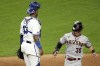 Arizona Diamondbacks' Jake McCarthy (30) runs past Kansas City Royals catcher Salvador Perez to score on a single by Geraldo Perdomo during the sixth inning of a baseball game Tuesday, Aug. 23, 2022, in Kansas City, Mo. (AP Photo/Charlie Riedel)
