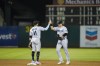 Miami Marlins shortstop Miguel Rojas, left, celebrates with left fielder JJ Bleday, right, after the team's 5-3 victory against the Oakland Athletics in Oakland, Calif., Tuesday, Aug. 23, 2022. (AP Photo/Godofredo A. Vásquez)