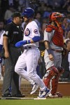Chicago Cubs' Patrick Wisdom scores against the St. Louis Cardinals during the second inning of a baseball game in Chicago, Wednesday, Aug. 24, 2022. (AP Photo/Matt Marton)