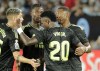 Real Madrid's Vinicius Junior celebrates with teammates after scoring his side's third goal during a Spanish La Liga soccer match between Celta Vigo and Real Madrid at the Balaidos stadium in Vigo, Spain, Saturday, Aug. 20, 2022. (AP Photo/Lalo R. Villar)