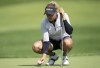 Pauline Roussin-Bouchard, from France, places her ball on the 6th green during the first day of action at the CP Women's Open, Thursday, August 25, 2022 in Ottawa. THE CANADIAN PRESS/Adrian Wyld