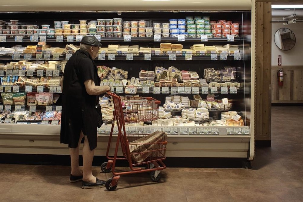 A man shops at a supermarket on Wednesday, July 27, 2022, in New York. An inflation gauge that is closely tracked by the Federal Reserve, Friday, July 29, jumped 6.8% in June from a year ago, the biggest increase in four decades, and leaving Americans with no relief from surging costs. (AP Photo/Andres Kudacki)