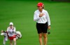 Canada's Lorie Kane puts her hand on her chest as she is applauded by fans, as her niece and caddy Charlotte Jenkins walks behind her on the green at the 18th hole during the CP Women's Open in Ottawa on Friday, Aug. 26, 2022. THE CANADIAN PRESS/Justin Tang