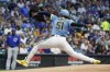 Milwaukee Brewers starting pitcher Freddy Peralta throws during the first inning of a baseball game against the Chicago Cubs Friday, Aug. 26, 2022, in Milwaukee. (AP Photo/Morry Gash)