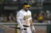 Oakland Athletics' Shea Langeliers walks to the dugout after striking out against the New York Yankees during the sixth inning of a baseball game in Oakland, Calif., Friday, Aug. 26, 2022. (AP Photo/Jeff Chiu)