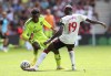 Manchester United's Anthony Elanga, left and Southampton's Moussa Djenepo battle for the ball, during the English Premier League match between Southampton and Manchester United, at St Mary's Stadium, Southampton, England, Saturday, Aug. 27, 2022. (Kieran Cleeves/PA via AP)