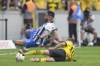Berlin's Marco Richter, top, is brought down by Dortmund's Thorgan Hazard during the German Bundesliga soccer match between Hertha BSC Berlin and Borussia Dortmund in Berlin, Germany, Saturday, Aug. 27, 2022. (AP Photo/Michael Sohn)
