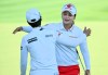 South Korea's Hye-Jin Choi embraces fellow South Korean Na Rin An, left,&nbsp;are co-leaders after three rounds at the CP Women's Open in Ottawa on Saturday, Aug. 27, 2022. THE CANADIAN PRESS/Justin Tang