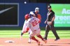 Toronto Blue Jays second baseman Santiago Espinal throws to first base to complete a double play on Los Angeles Angels Mike Trout after forcing David Fletcher (22) at second during third inning American League baseball action in Toronto on Saturday, August 27, 2022. THE CANADIAN PRESS/Jon Blacker