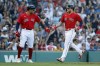 Boston Red Sox's Tommy Pham, left, and Alex Verdugo celebrate after scoring on a single by J.D. Martinez during the first inning of a baseball game against the Tampa Bay Rays, Saturday, Aug. 27, 2022, in Boston. (AP Photo/Michael Dwyer)